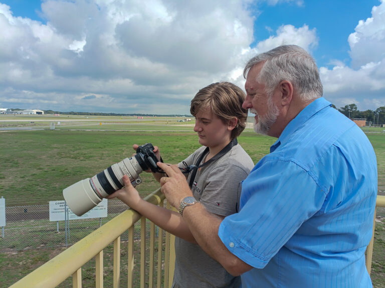 Christopher John teaching photography technique during a workshop