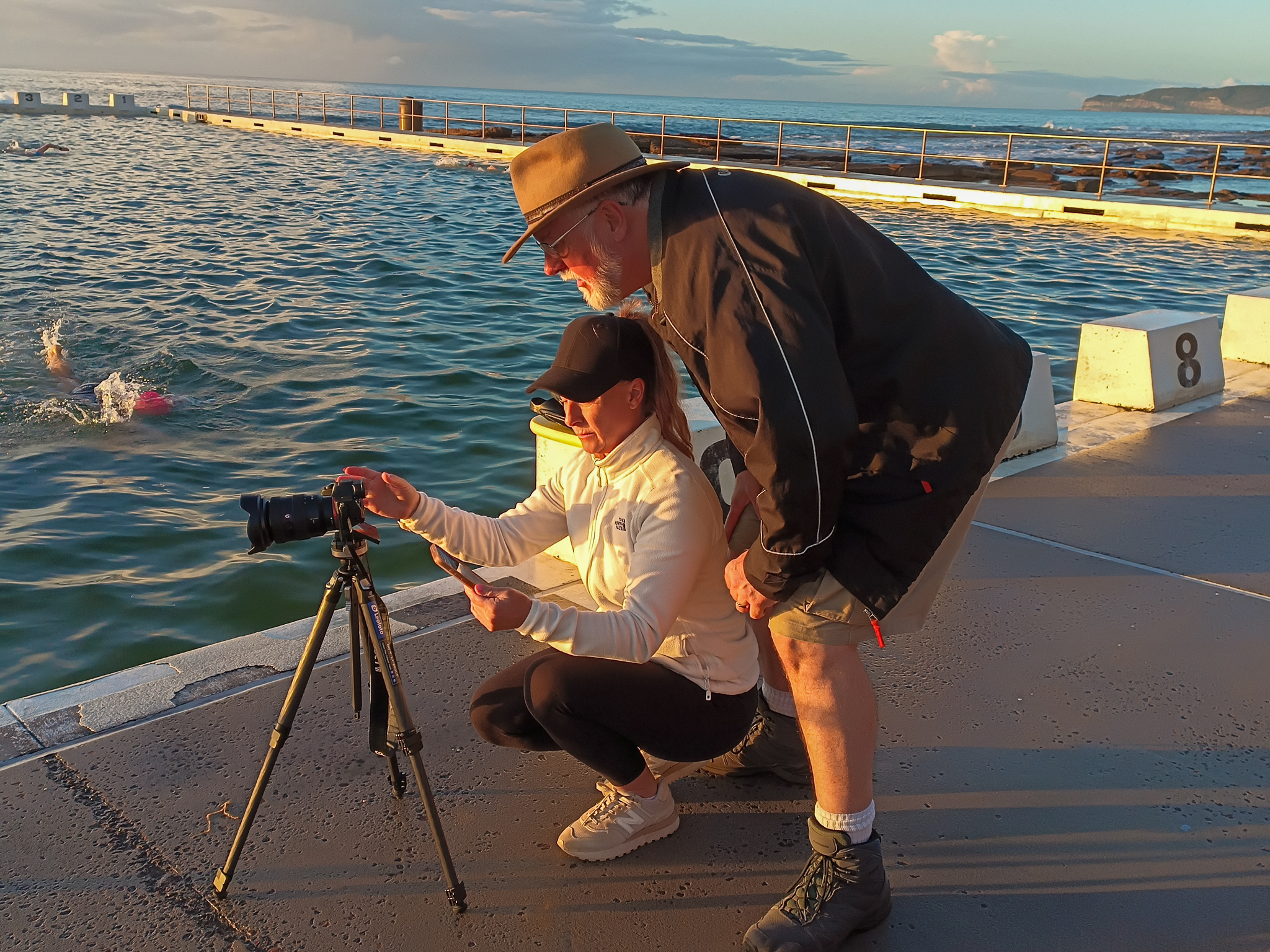 Photography Learning pathway at a workshop with participant reviewing an image with instructor at Merewether Ocean Baths