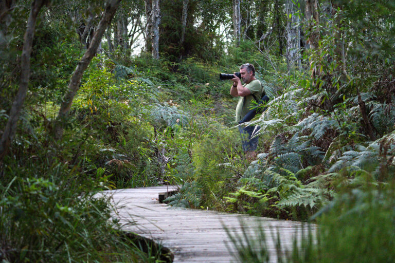 Photographer participating in a Crafted Image Academy field workshop in native bushland