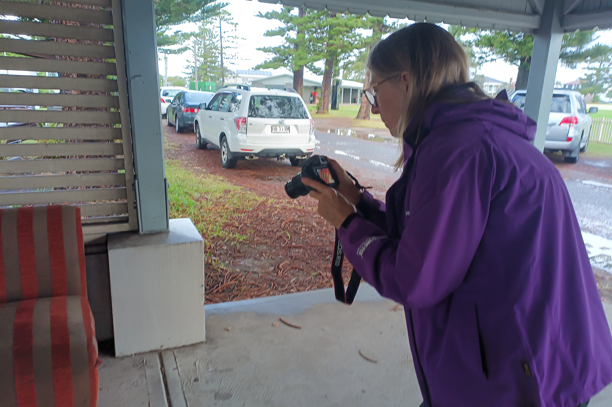 Beginner photographer practising camera skills during a hands-on photography workshop.