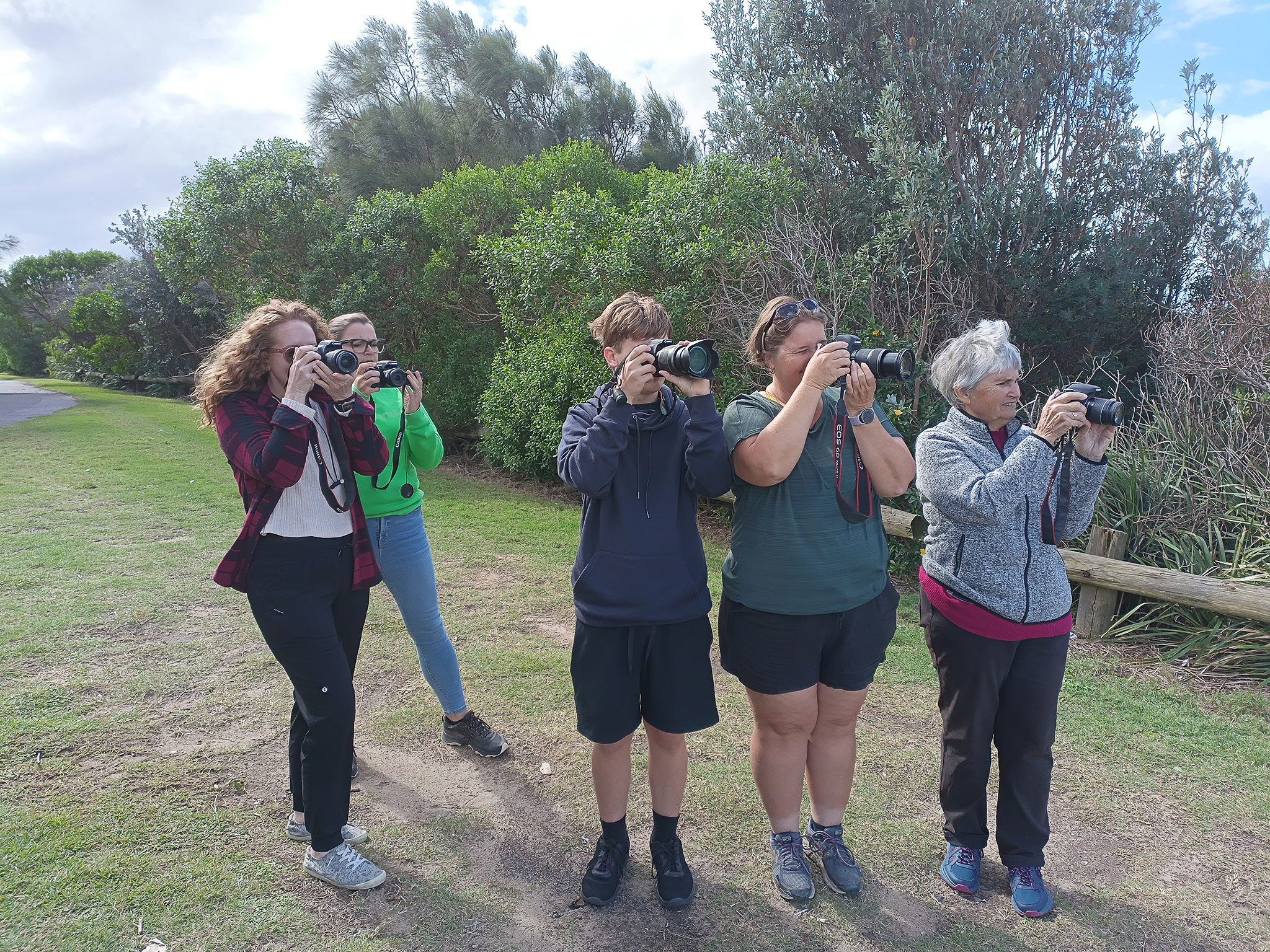 Participants learning beginner photography techniques during a Crafted Image Academy field workshop