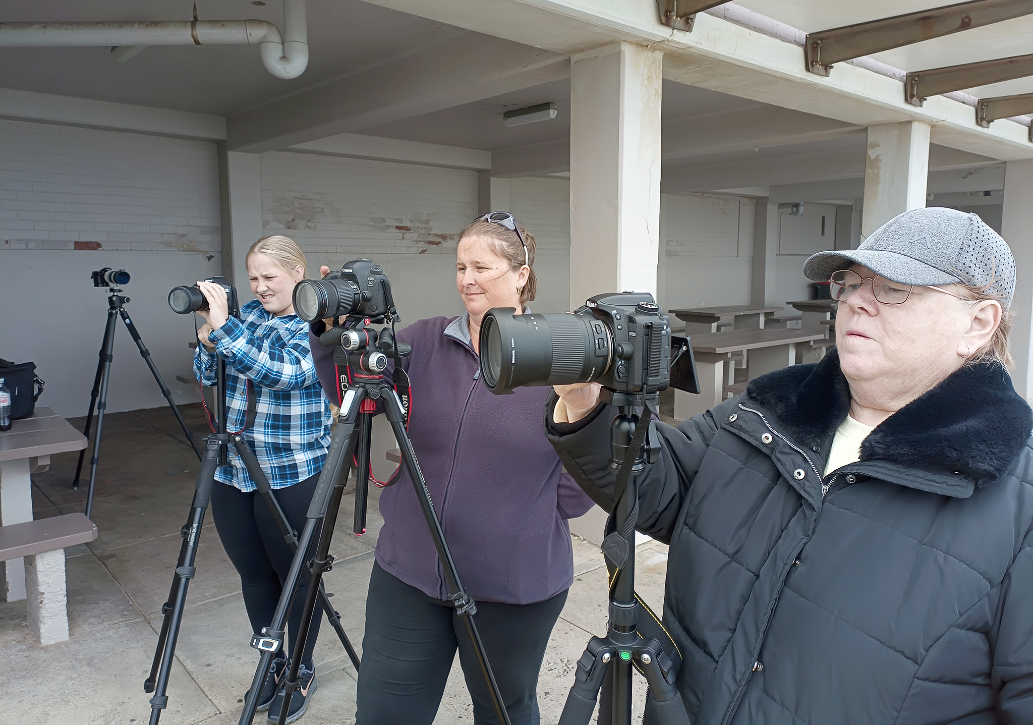 Participants practising camera techniques during a beginner photography workshop