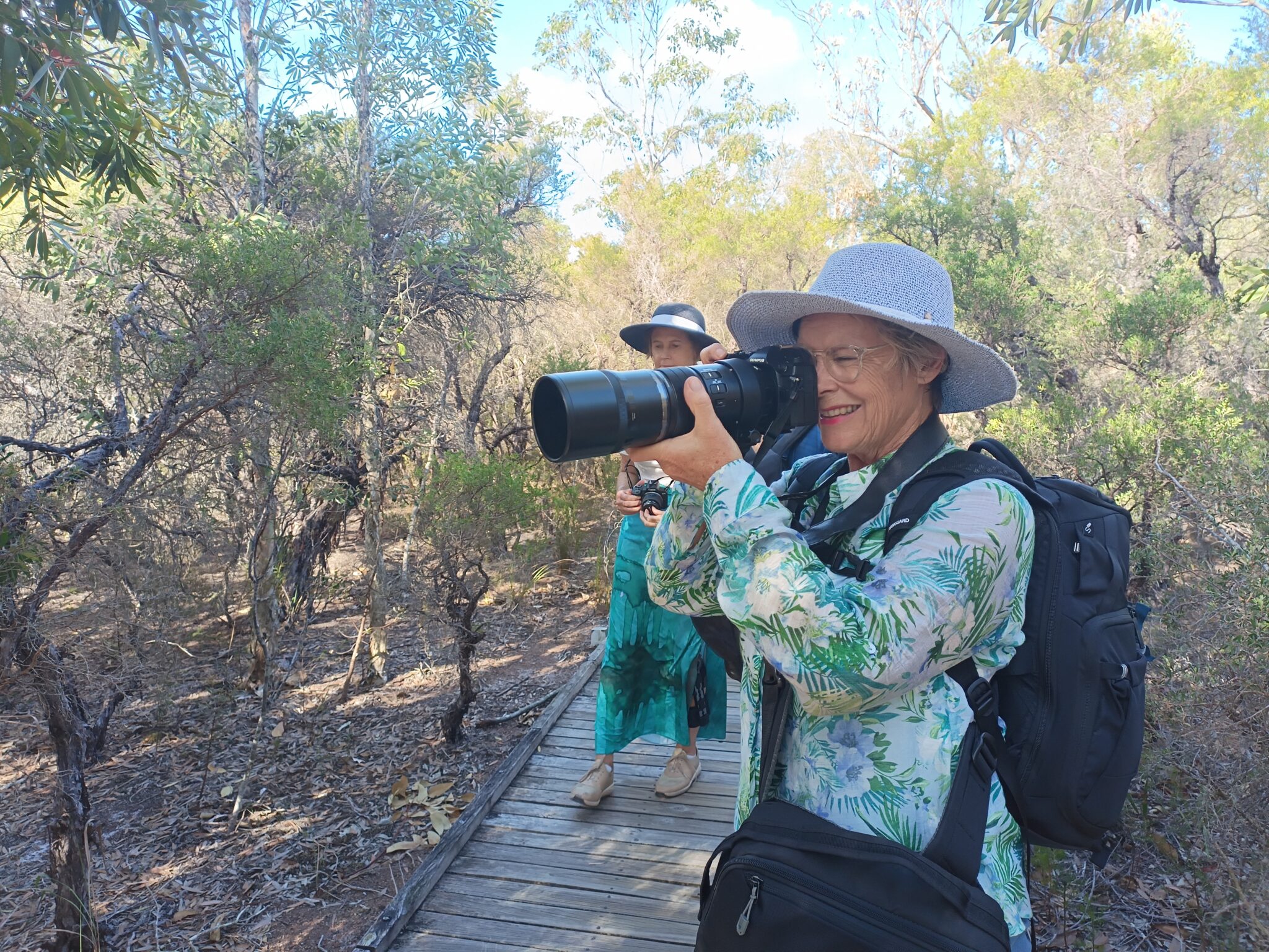 Photography workshop participant photographing in bushland during a Crafted Image Academy field workshop at Tilligerry Habitat - Photography Workshop Highlights